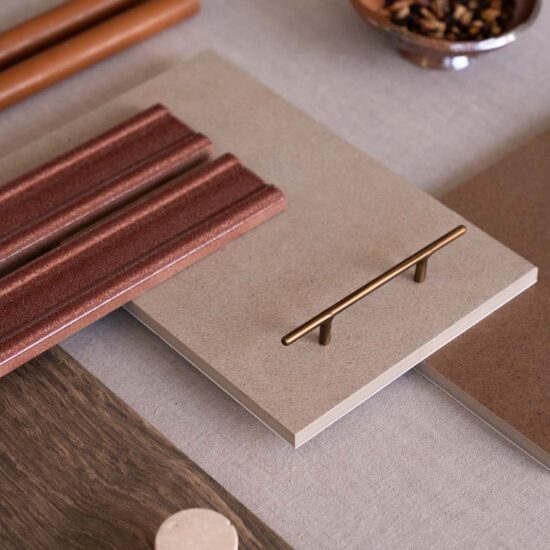 Various porcelain stoneware surfaces display warm tones, textured materials, and decorative details in a contemporary setting.