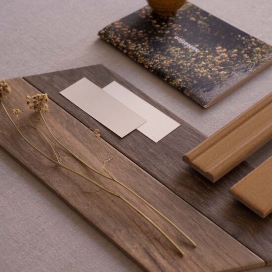 Surface with wood samples, warm tones, and natural texture, accompanied by decorative elements.